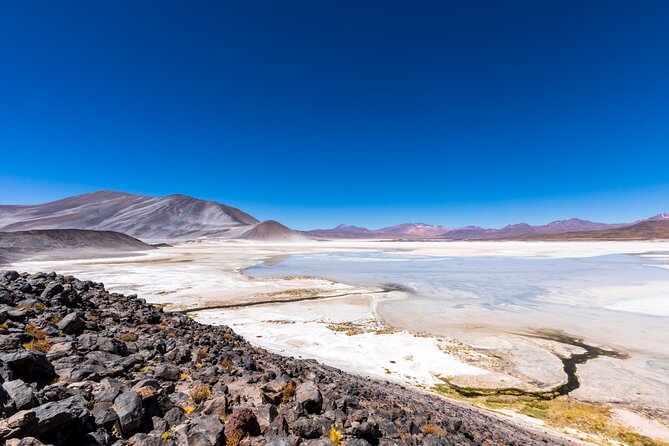 1-Day Tour Altiplanic Lagoons and Piedras Rojas and Laguna Chaxa - Piedras Rojas and the Red Stones Reflecting Pool Photo Stop
