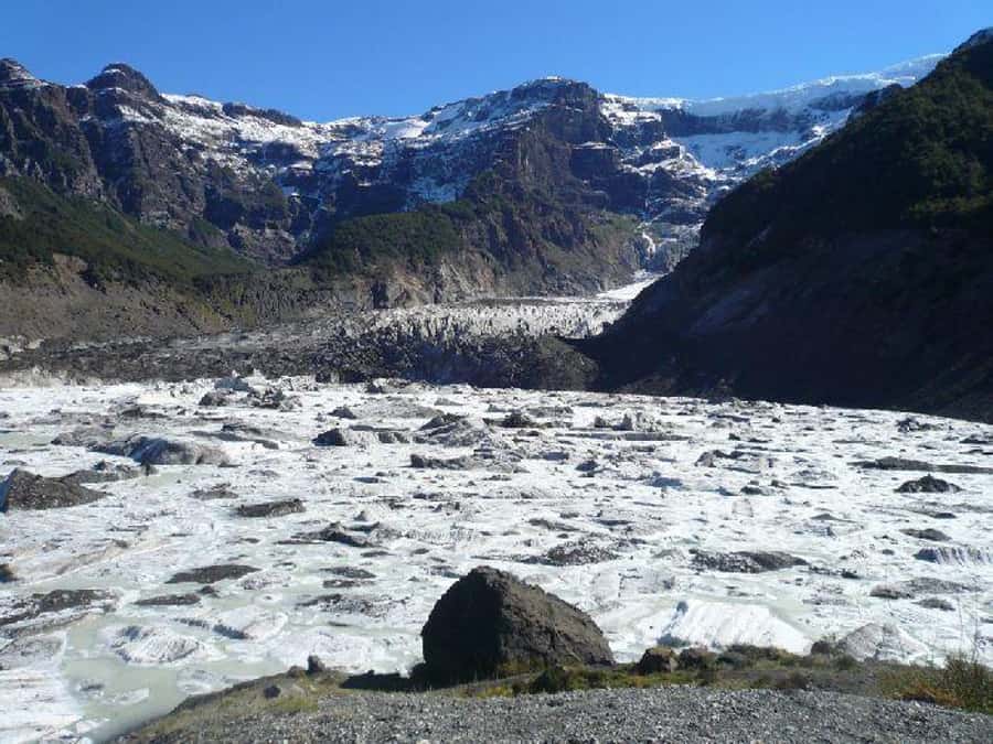 Cerro Tronador - La Garganta del Diablo: standing near a waterfall shaped by melted ice