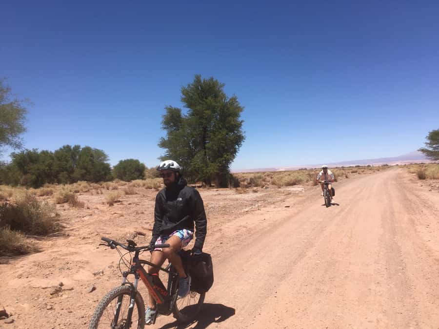 From San Pedro de Atacama: Laguna Cejar E-biking Adventure - Riding the Atacama salt flats on an e-bike, not a tour bus