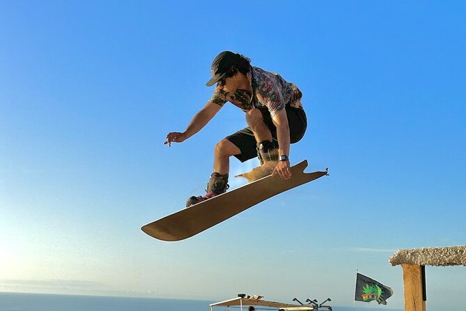 Sandboard activity in Iquique with transfer - Gear included: board, boots, helmet, and why that matters